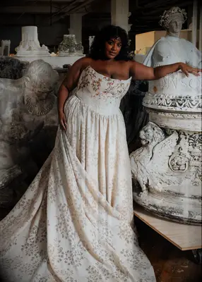 Plus-size strapless bridal dress with floral design