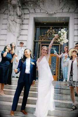 Couple and guests wearing courthouse wedding attire