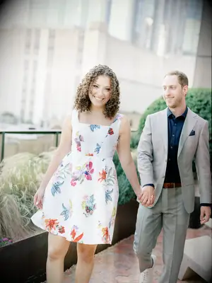 Couple holding hands for engagement pictures