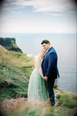 Romantic engagement picture on a cliff