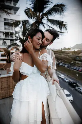 Loving engagement picture on a balcony