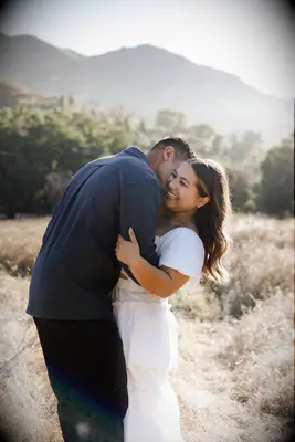 Romantic couple photo in a field
