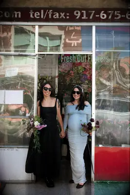 Engagement couple holding flowers