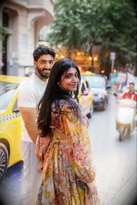 Couple holding hands walking on the street
