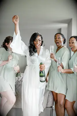 Bride celebrating with bridesmaids