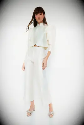 Neutral cropped jacket for wedding guest to wear over dress