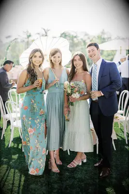 Wedding guests smiling at summer wedding