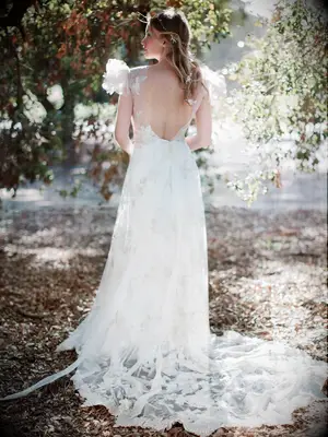 Illusion neckline and tulle puff sleeves with appliqué on skirt