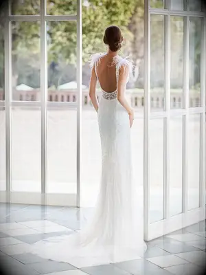 Fitted beaded skirt with scoop back and feather straps