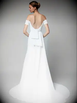 Off the shoulder sleeves and scoop back with bow