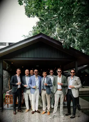 Groom with groomsmen posing for a picture