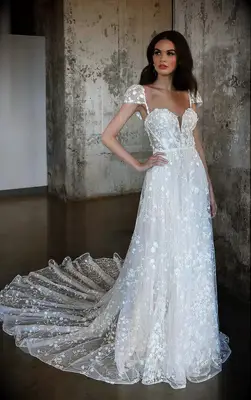 Lace A-line wedding dress with cap sleeves and 3D floral details by Martina Liana