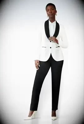 Woman wearing black and ivory tuxedo lesbian wedding suit