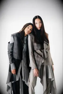 Two women wearing lesbian wedding suits from The Tailory