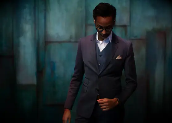 Model wearing dark grey lesbian wedding suit