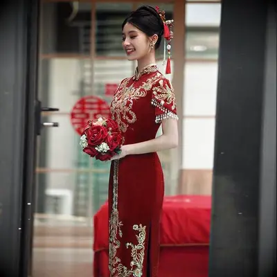 Qipao by Ting embroidered red and gold qipao wedding dress
