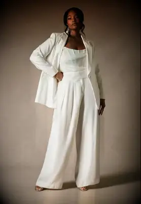 Woman wearing white pantsuit for wedding