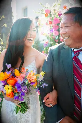 Bride laughing with her father