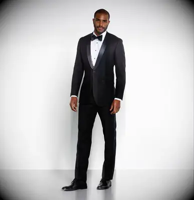Man wearing a black tux with bow tie