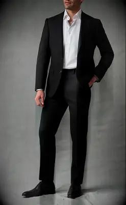 Black suit with slightly opened white button shirt