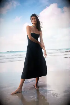 Black strapless drop waist midi wedding guest dress over 50 from Free People