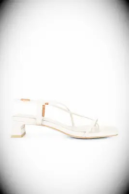 INTENTIONALLY BLANK cream sandals to wear with yellow dress