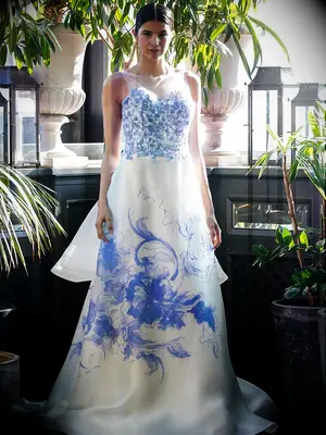 White wedding gown by Francesca Miranda​ with blue floral details