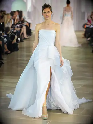 Pale blue Ines DiSanto​ strapless wedding gown with painted floral organza 