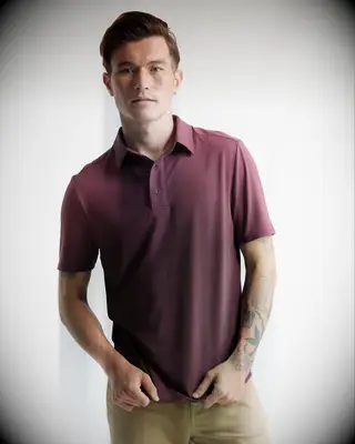 Burgundy polo shirt from Quince for gold bachelor party outfit