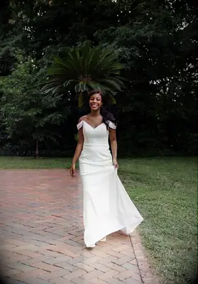 crepe floor length dress with off the shoulder straps and v neck