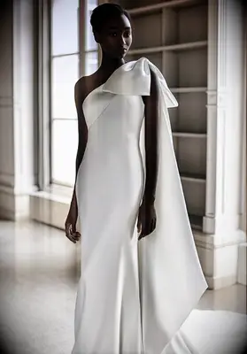 fit and flare floor length dress with asymmetrical bow shoulder