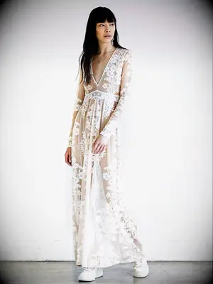 Naked long sleeve lace gown with long sleeves and plunging neckline
