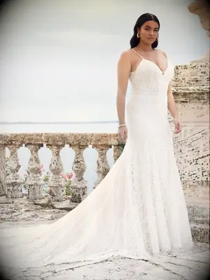 Gown with intricate beading and spaghetti straps