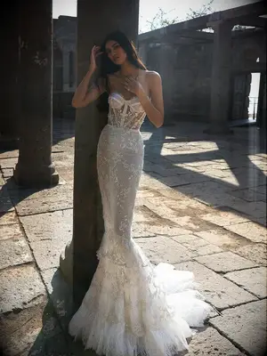 Fit and flare dress with strapless corset bodice and skirt with lace ruffles