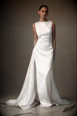 Bride wearing a white, high neck satin wedding dress