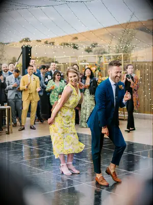 Groom and mother of the groom dancing at the reception. 