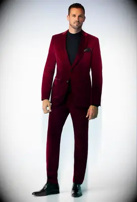Man wearing a red velvet suit jacket