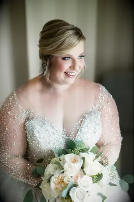 bride wearing wedding dress with illusion neckline