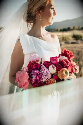 bride wearing one shoulder wedding dress
