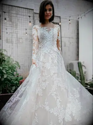 Illusion neckline and long sleeves with tulle floral applique