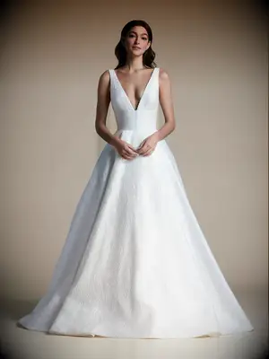 Plunging neckline with pearl detailing and lace A-line skirt