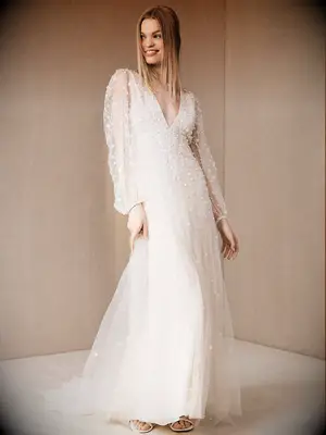 Long illusion sleeve and deep V-neck with pearl embellishments