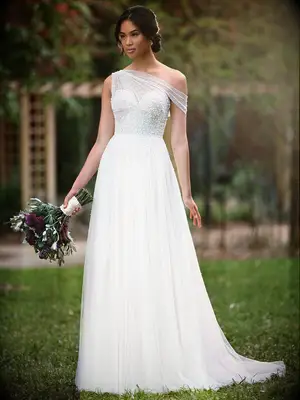Tulle asymmetrical sleeves and skirt with pearl beading on bodice