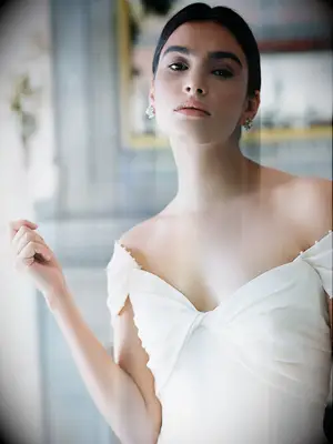 Minimalist A-line dress with off the shoulder sleeves and pearl detailing