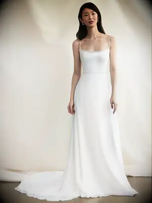 Minimalist gown with pearl spaghetti straps and neckline