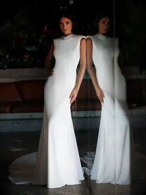 Crepe sleeveless gown with pearl and rhinestone high neckline