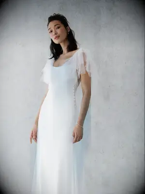 Tulle flutter sleeve jacket with pearl embellishments