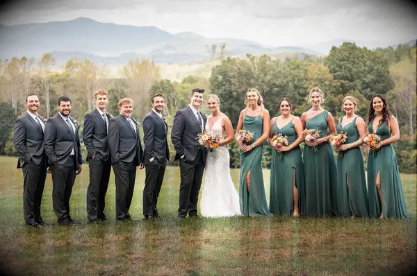 Wedding party portrait with groom and groomsmen wearing Kennedy Blue suits