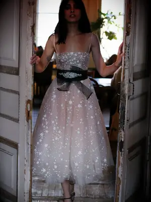 Midi tulle dress with star embellishments and black sash belt