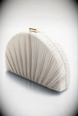 Clam shaped clutch purse